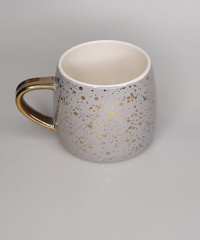 TAZA MANGO Y BRILLOS DORADOS FONDO GRIS