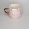 TAZA MANGO Y BRILLOS DORADOS FONDO ROSA